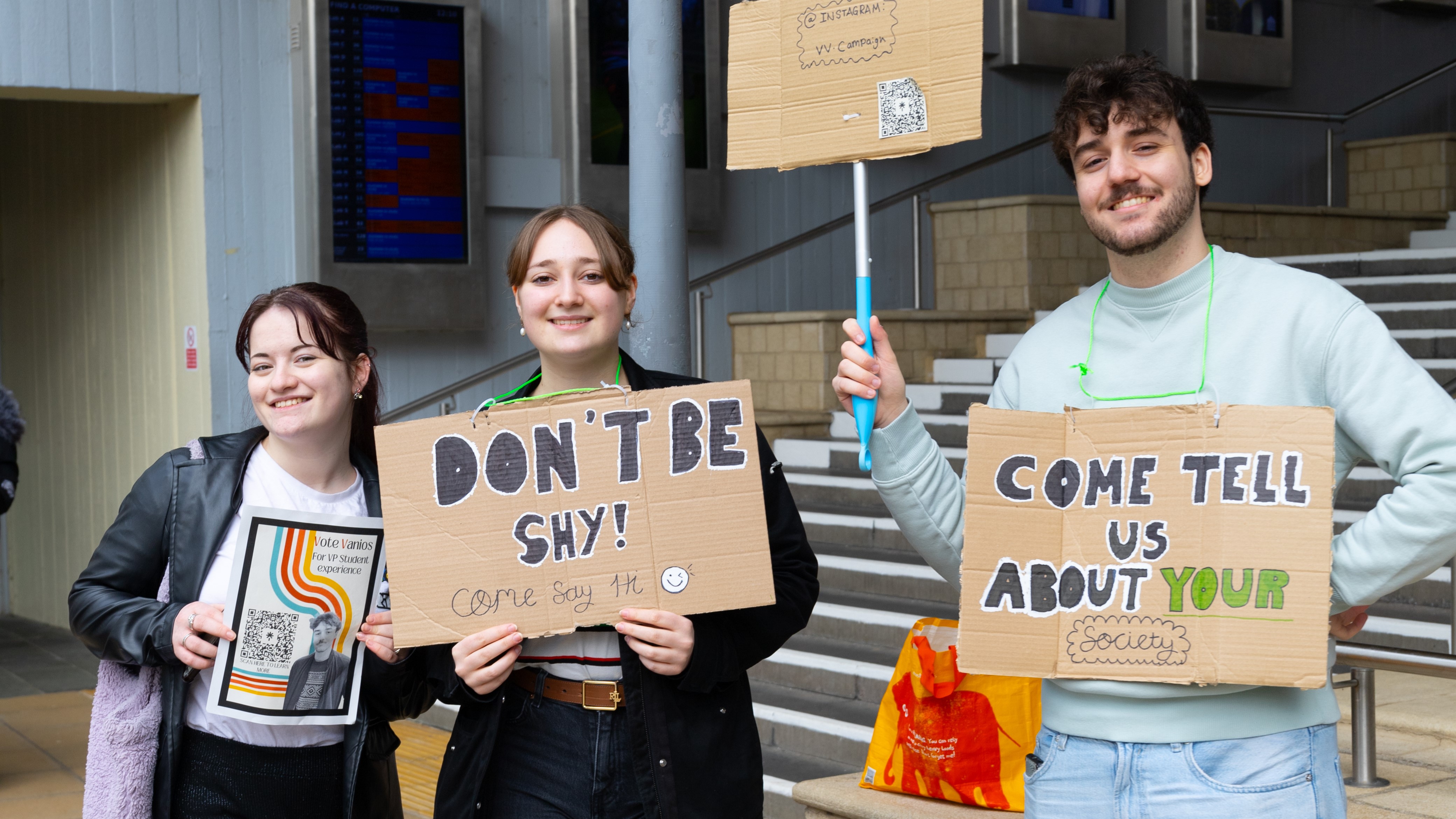 Essex students with election campaign signs