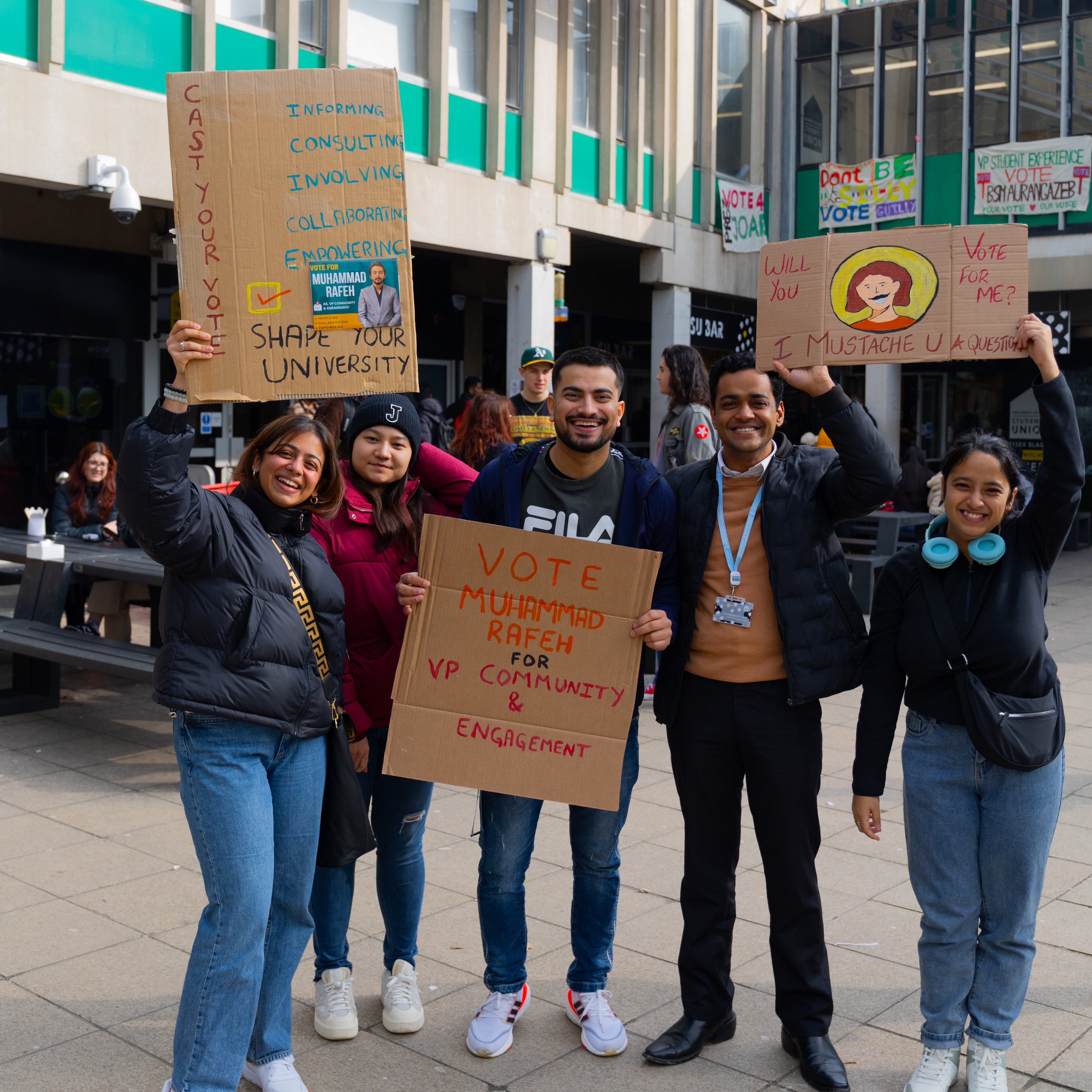 Group of Essex Students with campaign signs